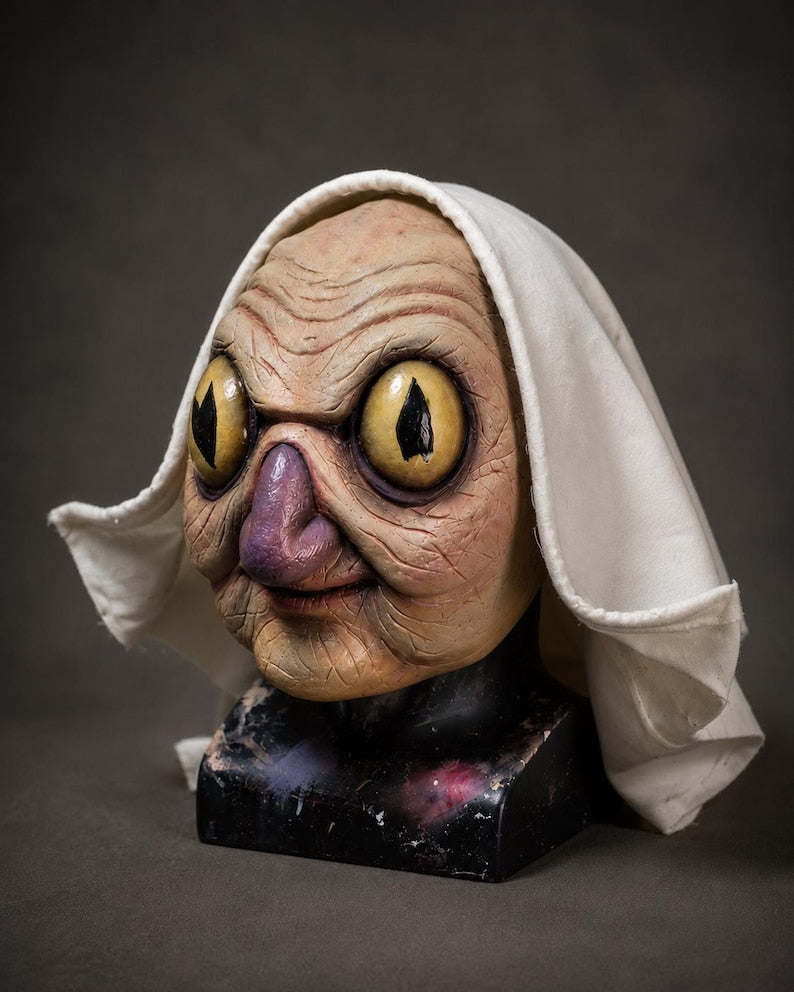 Auntie Whispers replica latex display mask prop over the garden wall