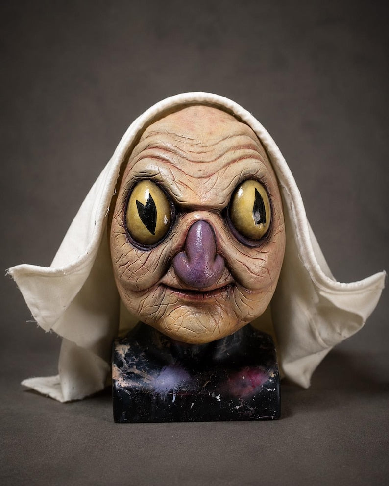 Auntie Whispers replica latex display mask prop over the garden wall